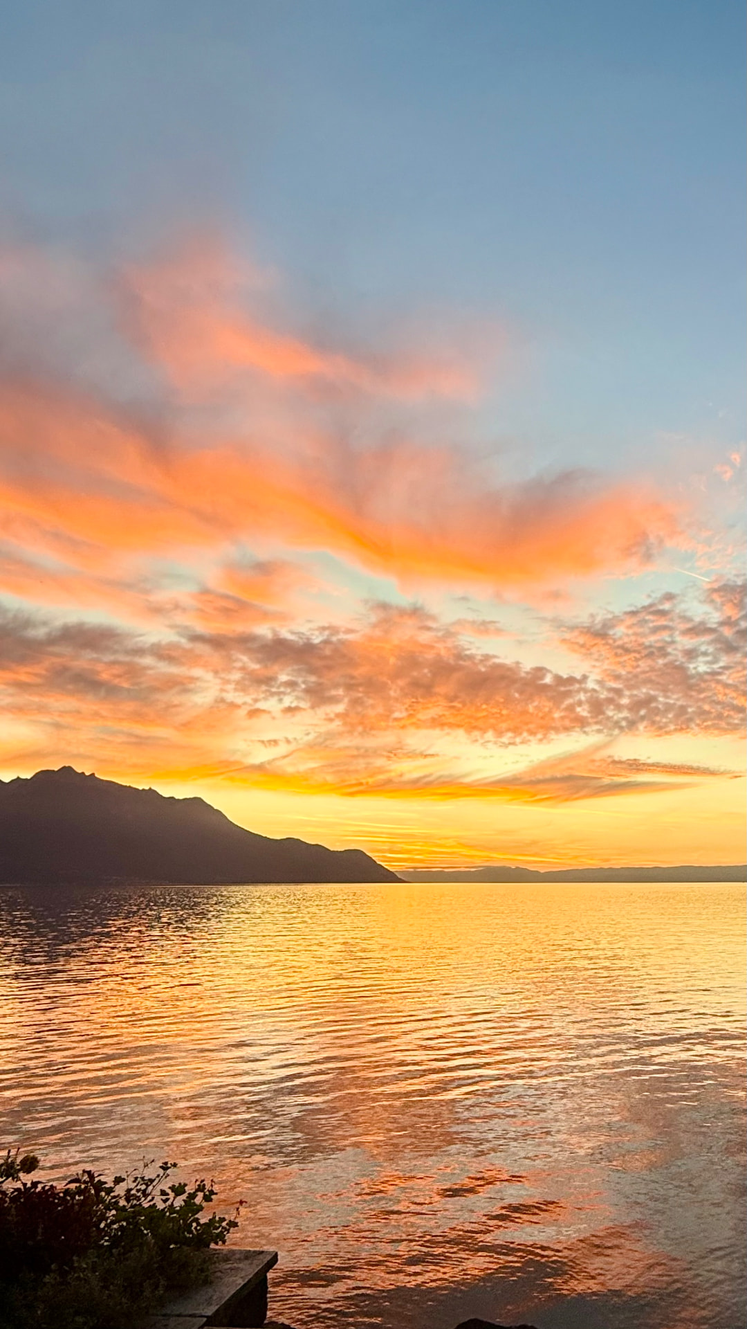 Sunset over Lake Geneva with the mountain silhouette